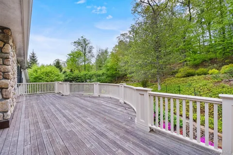 a view of balcony with wooden floor