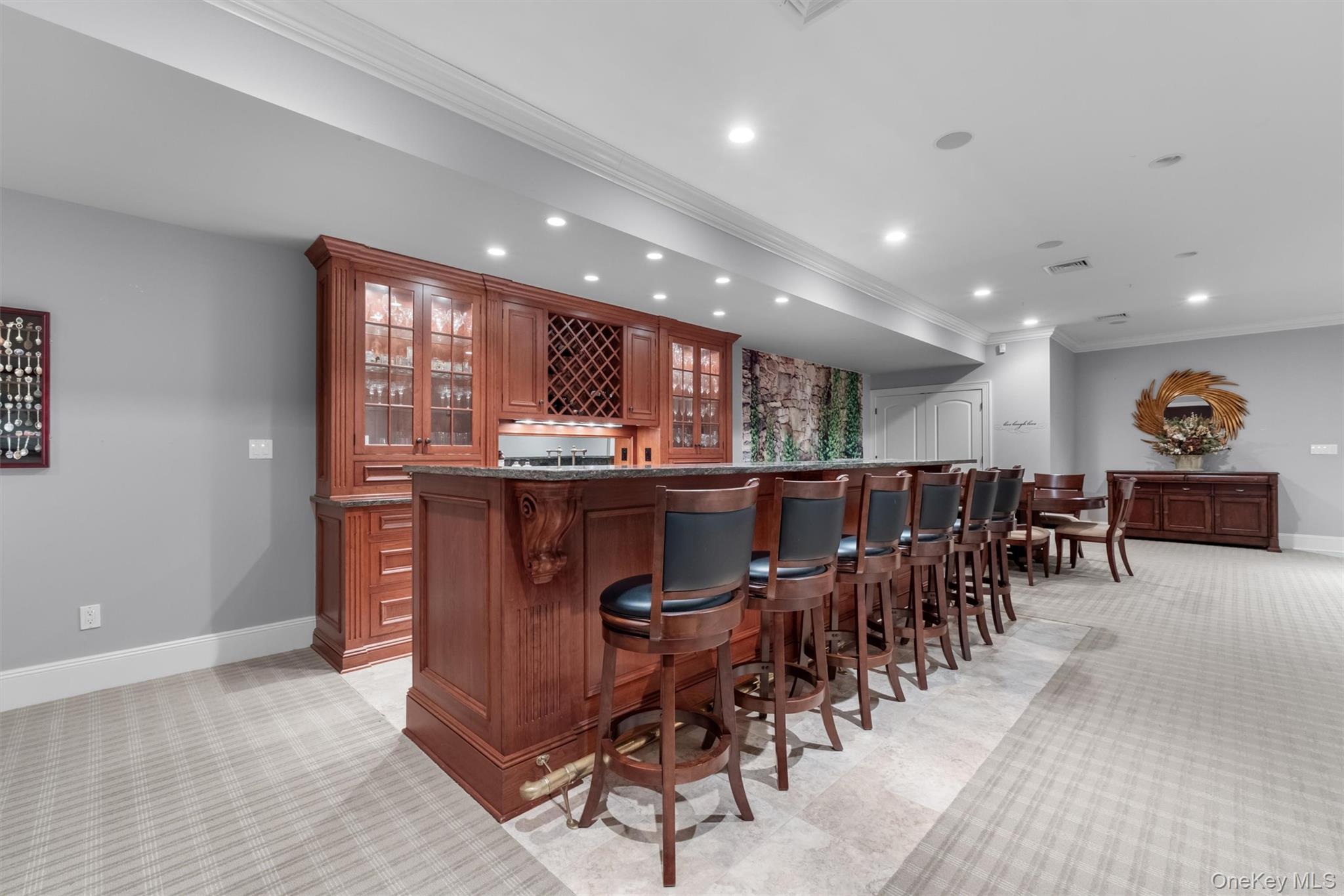 7 Ridgeview Circle Armonk, NY 10504 - Photo 21 of 35 a kitchen with stainless steel appliances kitchen island granite countertop a table and chairs in it