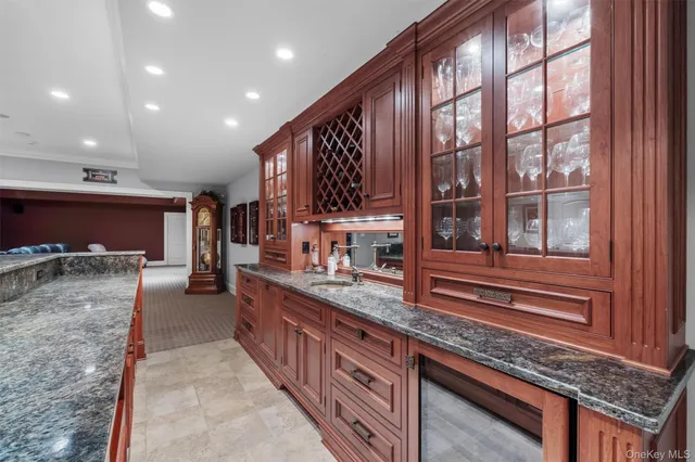 a kitchen with sink and cabinets