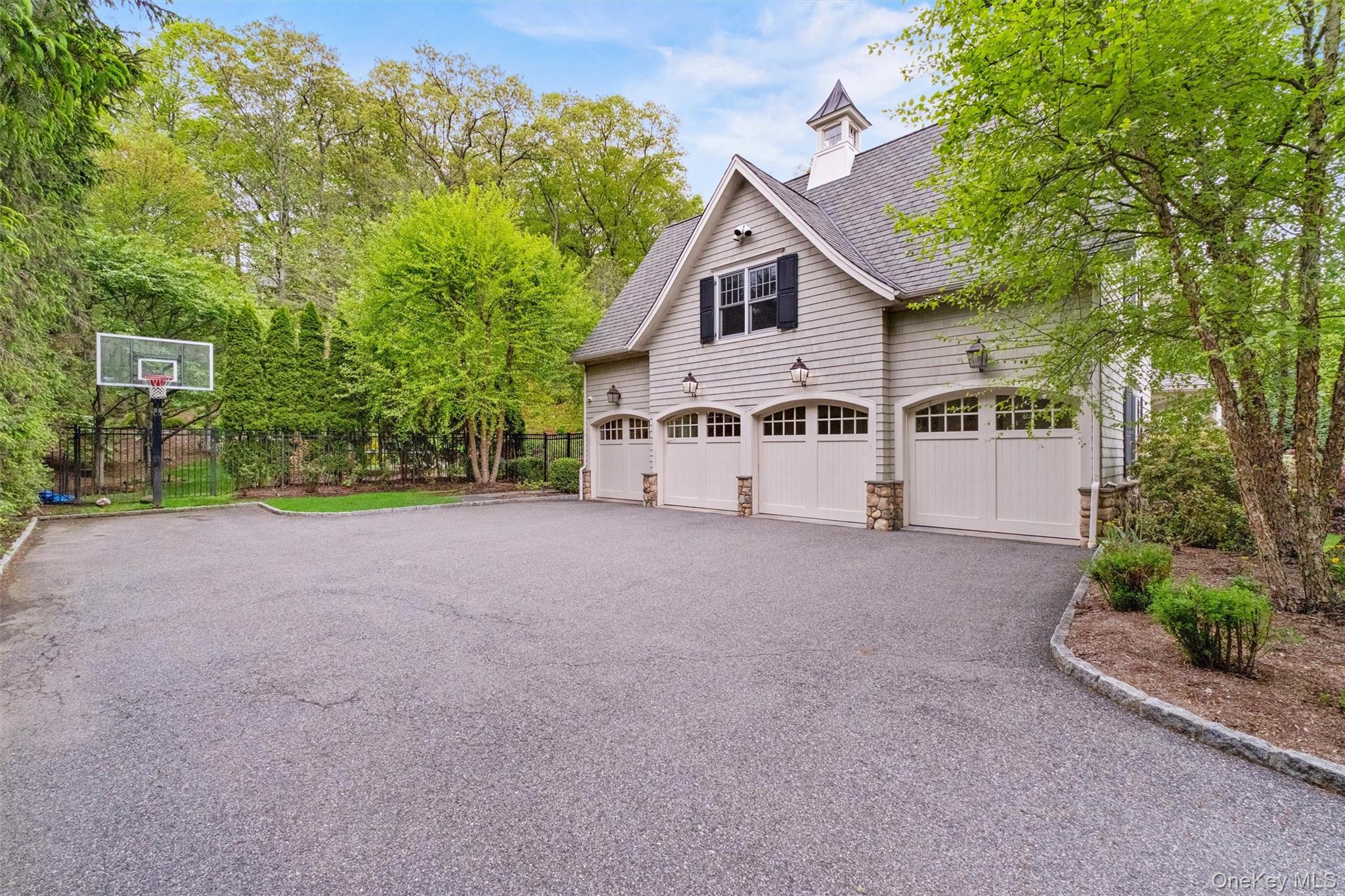 7 Ridgeview Circle Armonk, NY 10504 - Photo 30 of 35 a view of a house with a yard and garage