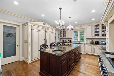 a kitchen with kitchen island granite countertop lots of counter top space
