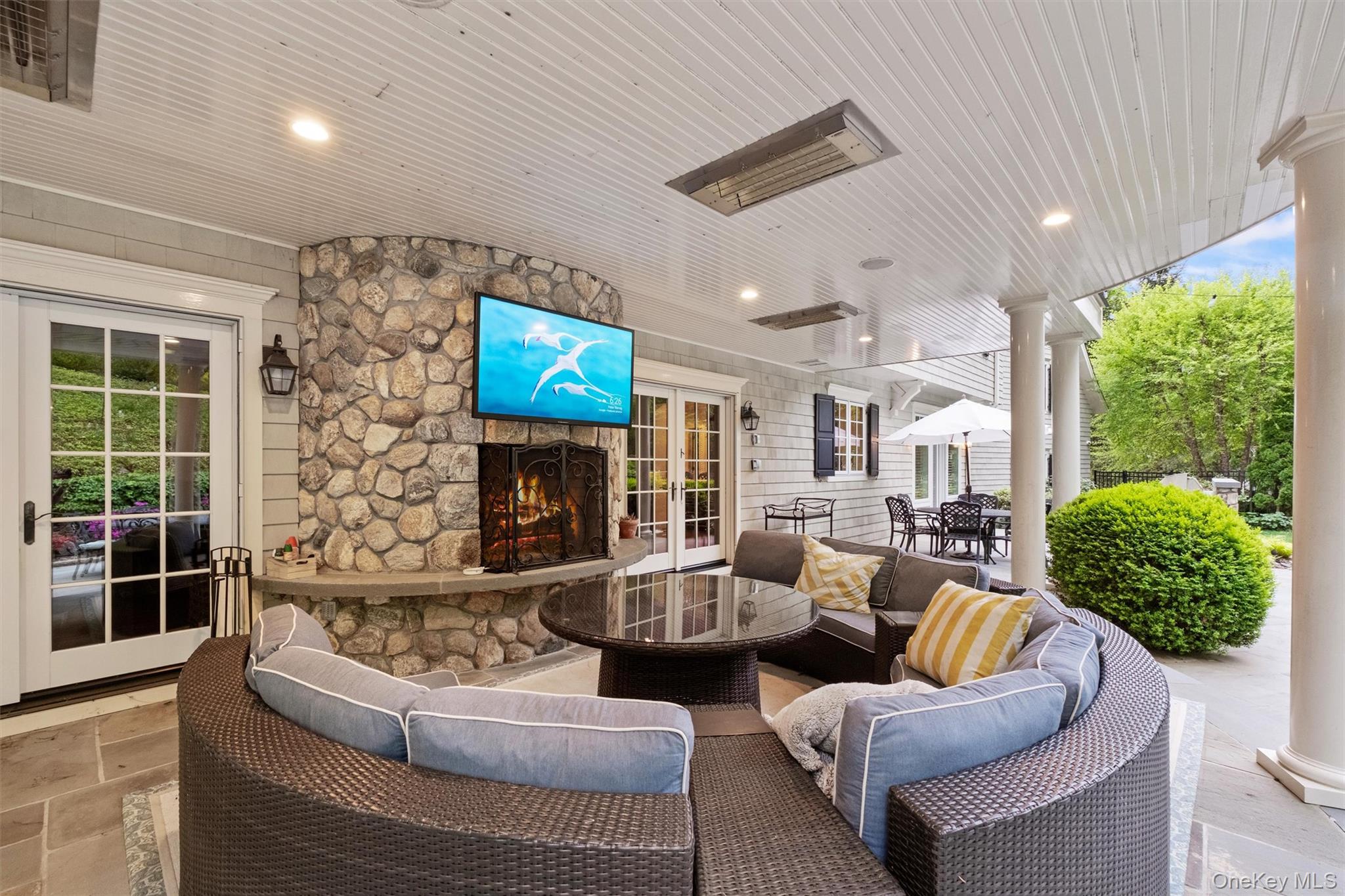 7 Ridgeview Circle Armonk, NY 10504 - Photo 10 of 35 a living room with fireplace furniture and a flat screen tv