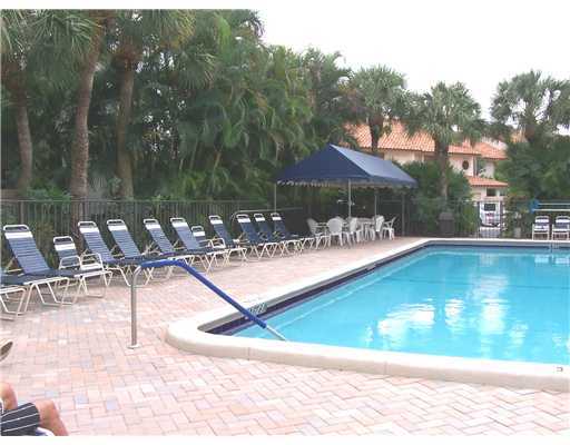 7727 La Mirada Drive, Unit 118 Boca Raton, FL 33433 - Photo 16 of 16 a view of a swimming pool with chairs