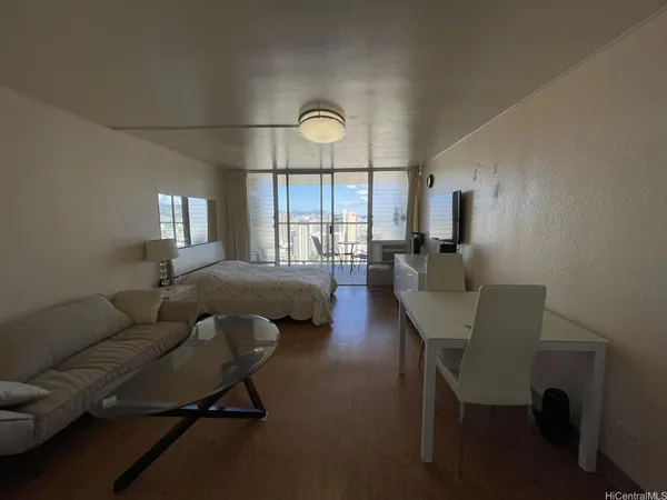 a living room with furniture and a large window