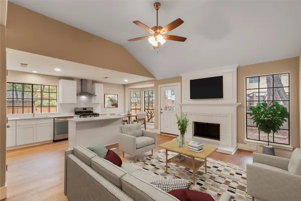 a living room with furniture fireplace and window