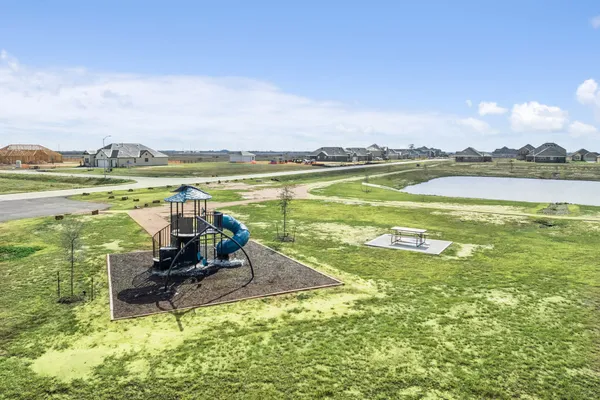 a view of a swimming pool and an outdoor space