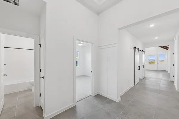 a view of a hallway with a room