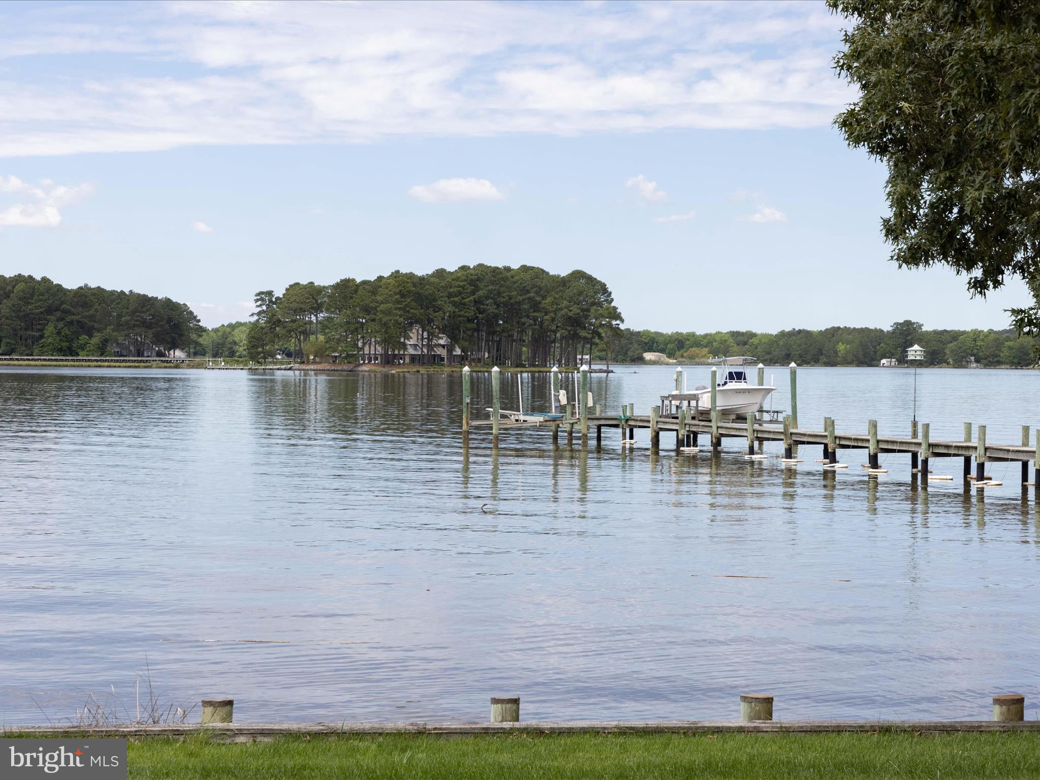 11114 Spring Branch Lane Berlin, MD 21811 - Photo 13 of 75 a view of a lake with houses in the back