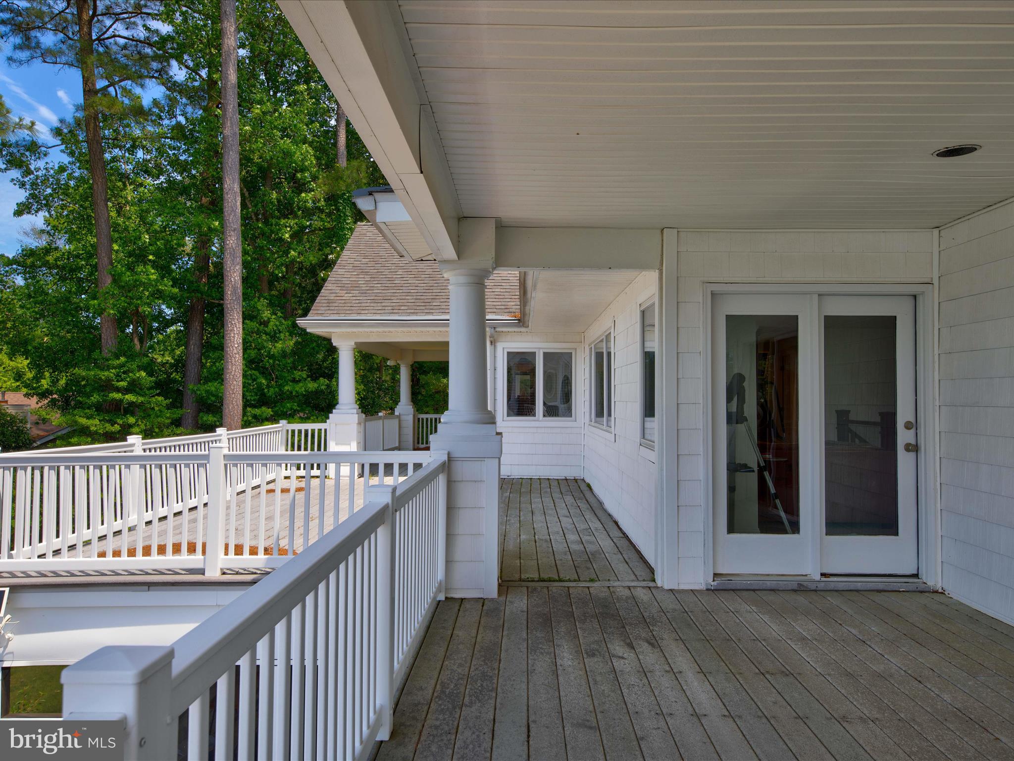 11114 Spring Branch Lane Berlin, MD 21811 - Photo 29 of 75 a view of balcony with deck and outdoor seating