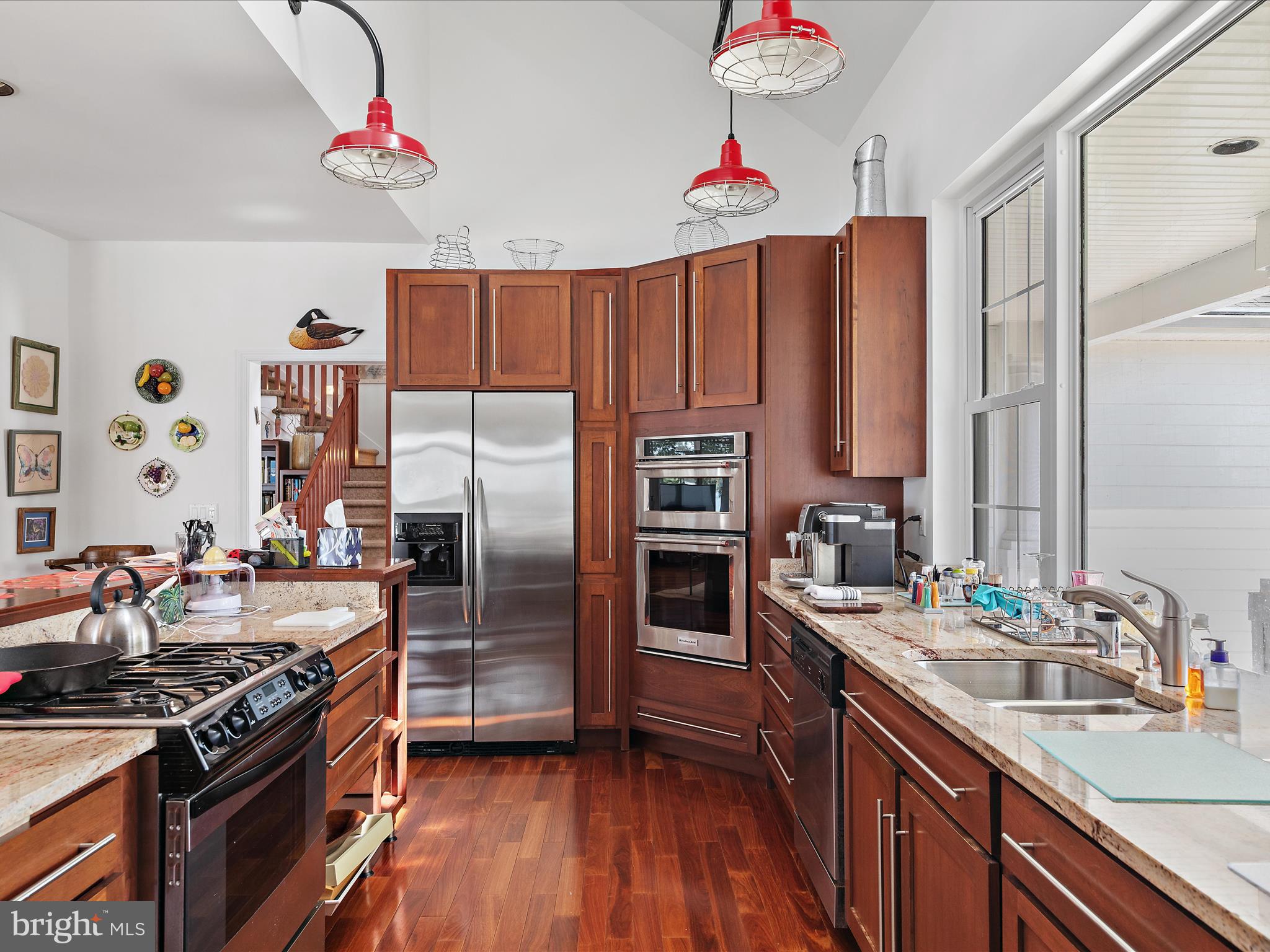 11114 Spring Branch Lane Berlin, MD 21811 - Photo 38 of 75 a kitchen with stainless steel appliances granite countertop a stove refrigerator and a sink