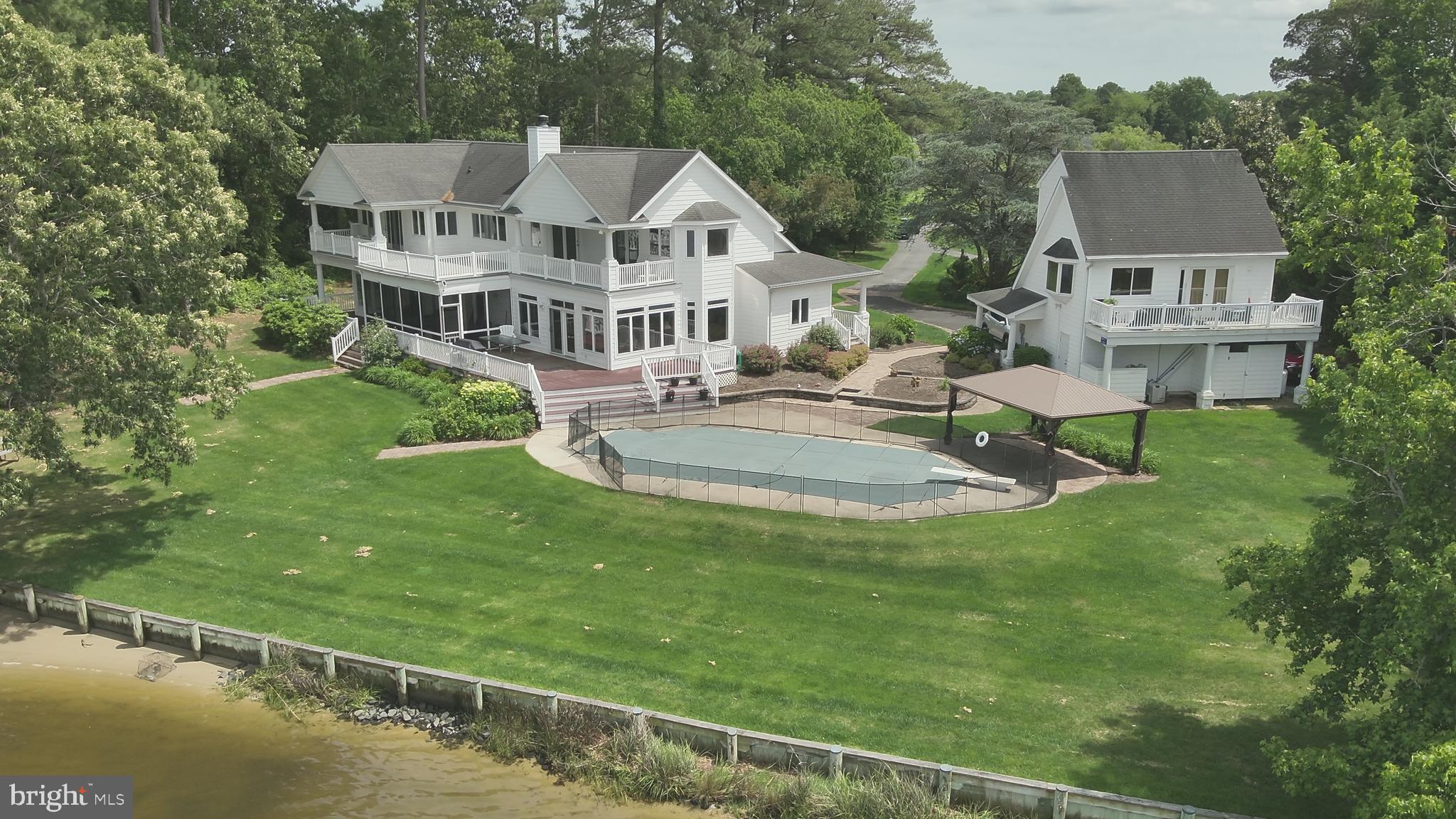 11114 Spring Branch Lane Berlin, MD 21811 - Photo 55 of 75 a view of a house with a big yard and large trees
