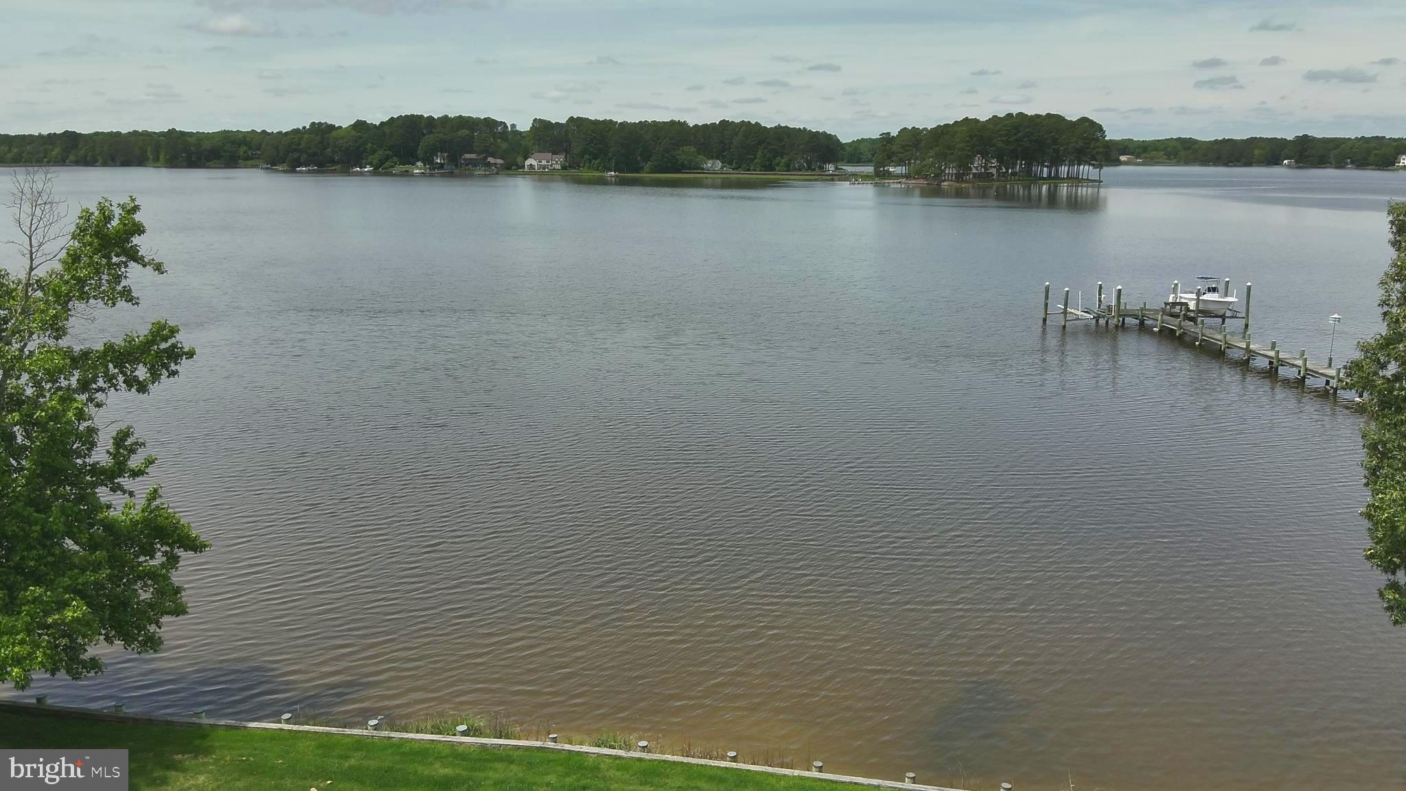 11114 Spring Branch Lane Berlin, MD 21811 - Photo 56 of 75 a view of a lake with a mountain in the background