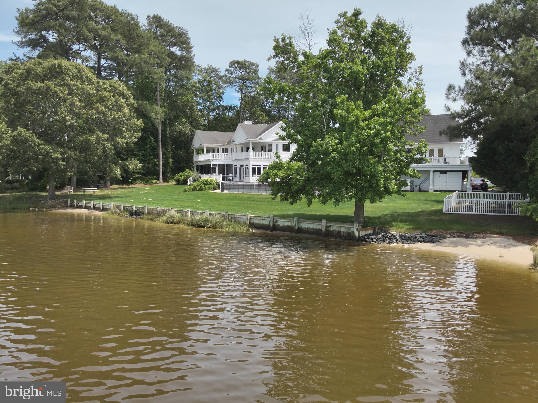 11114 Spring Branch Lane Berlin, MD 21811 - Photo 57 of 75 a view of a lake with a house in the background