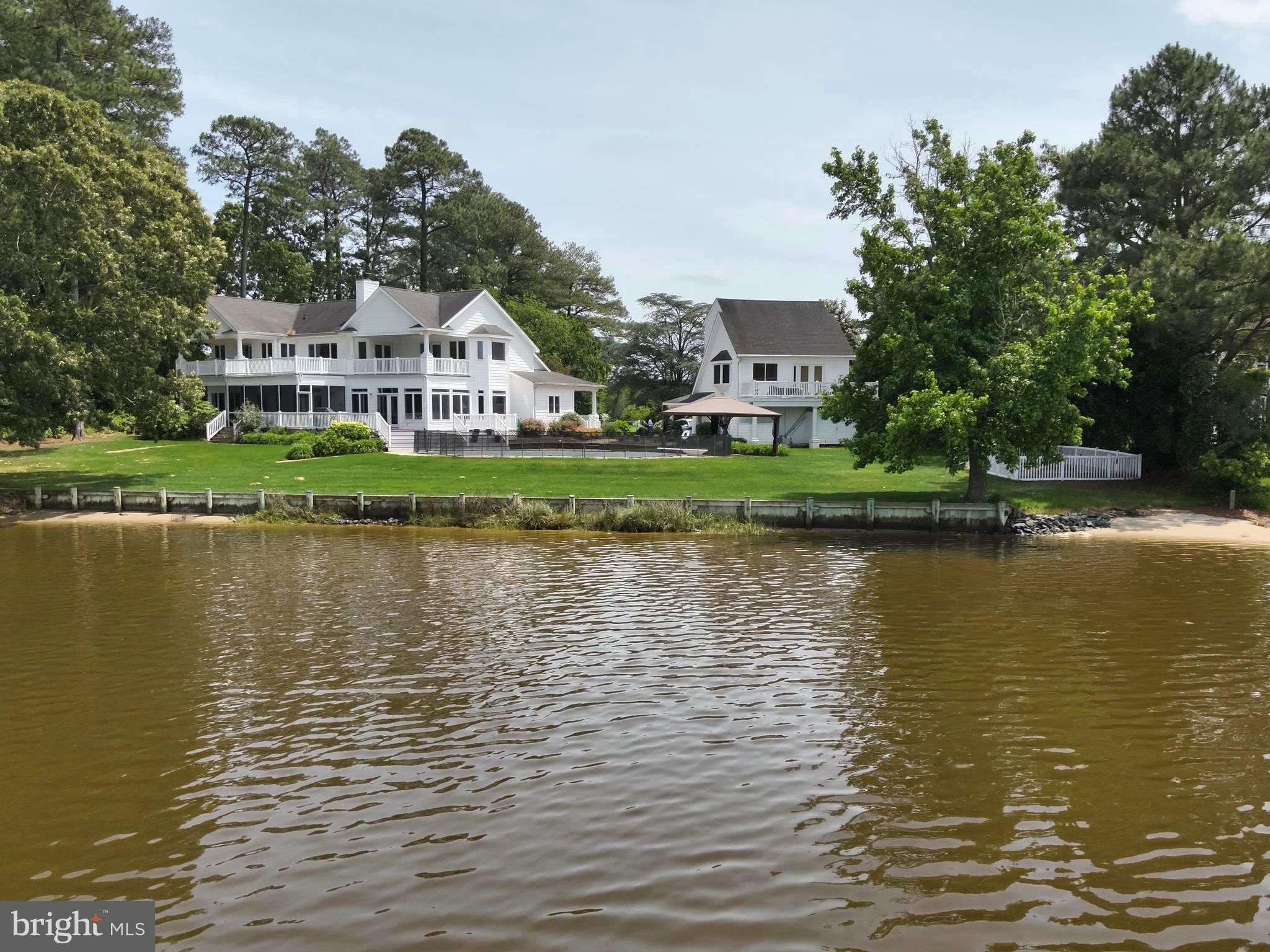 11114 Spring Branch Lane Berlin, MD 21811 - Photo 61 of 75 a view of a lake with a house in the background