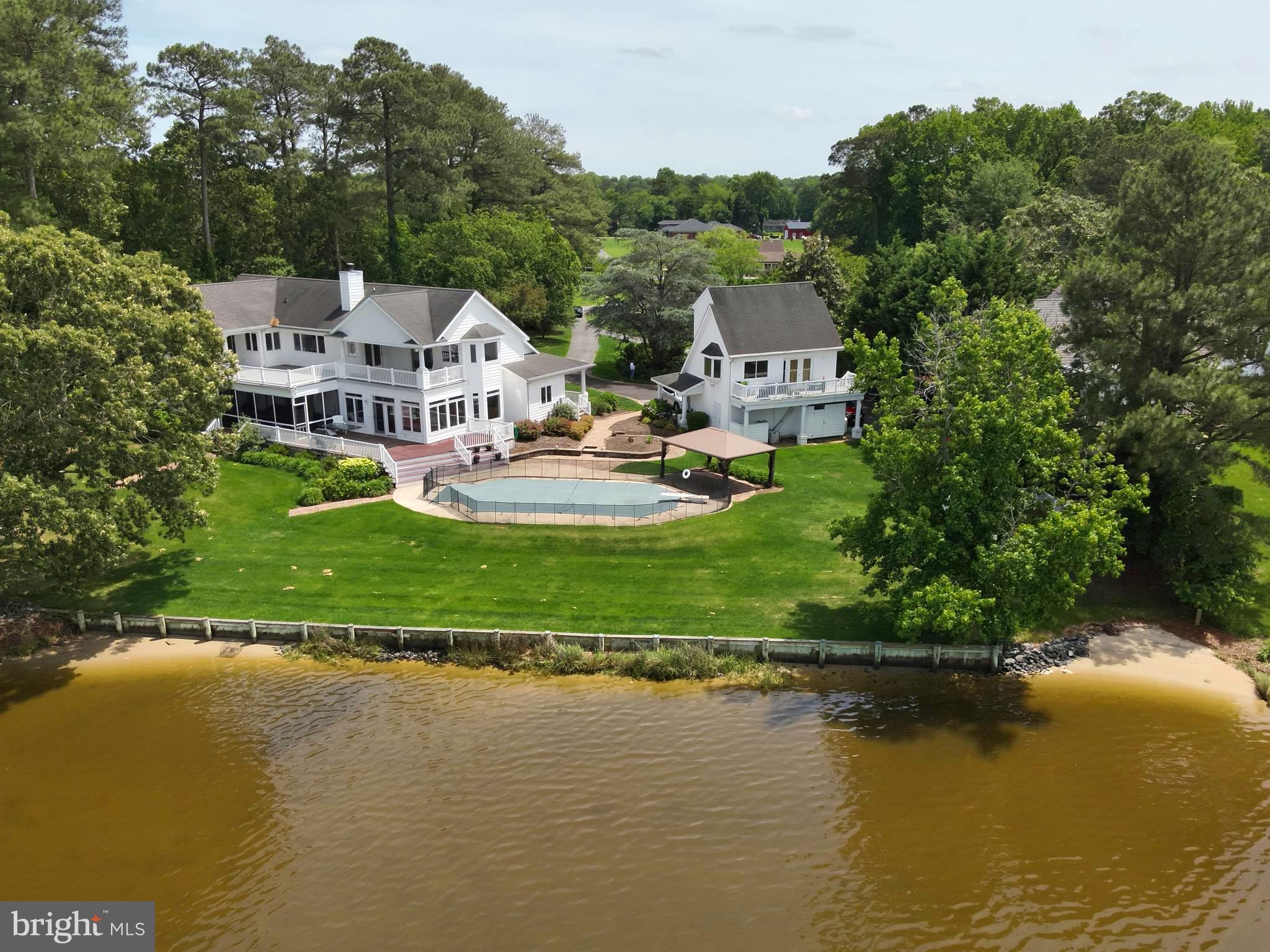 11114 Spring Branch Lane Berlin, MD 21811 - Photo 63 of 75 an aerial view of a house with a garden and lake view