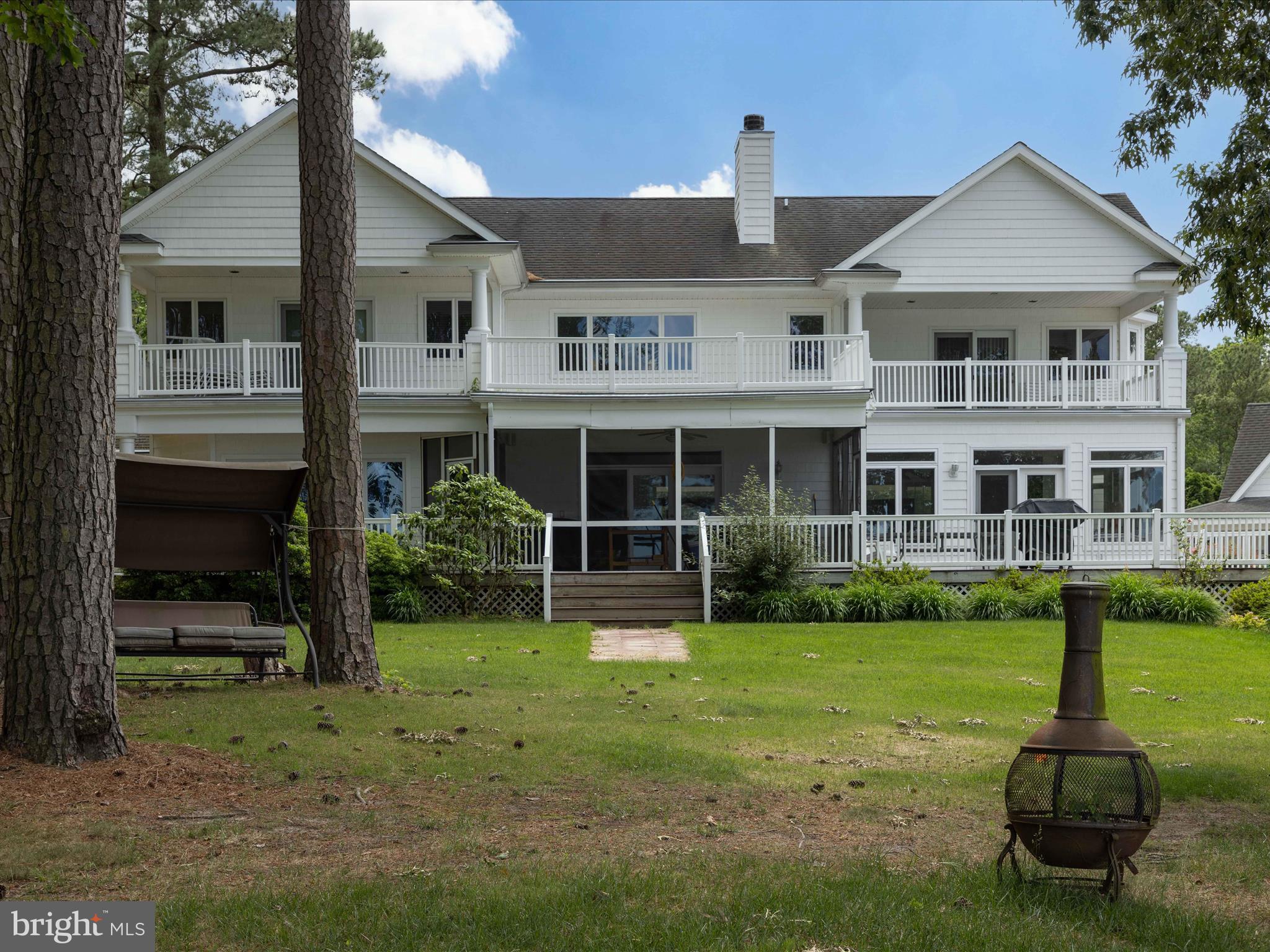 11114 Spring Branch Lane Berlin, MD 21811 - Photo 9 of 75 a front view of a house with a yard