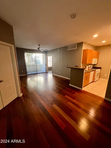 a view of a room with wooden floor