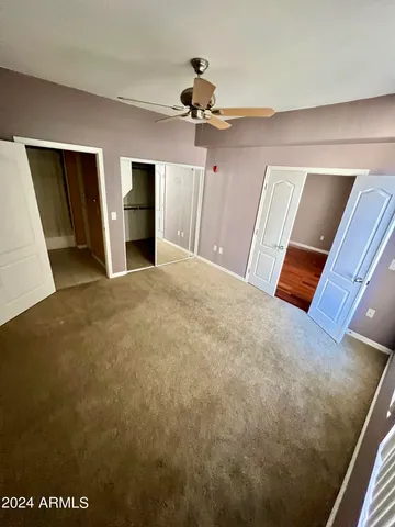 a view of an empty room with a fireplace