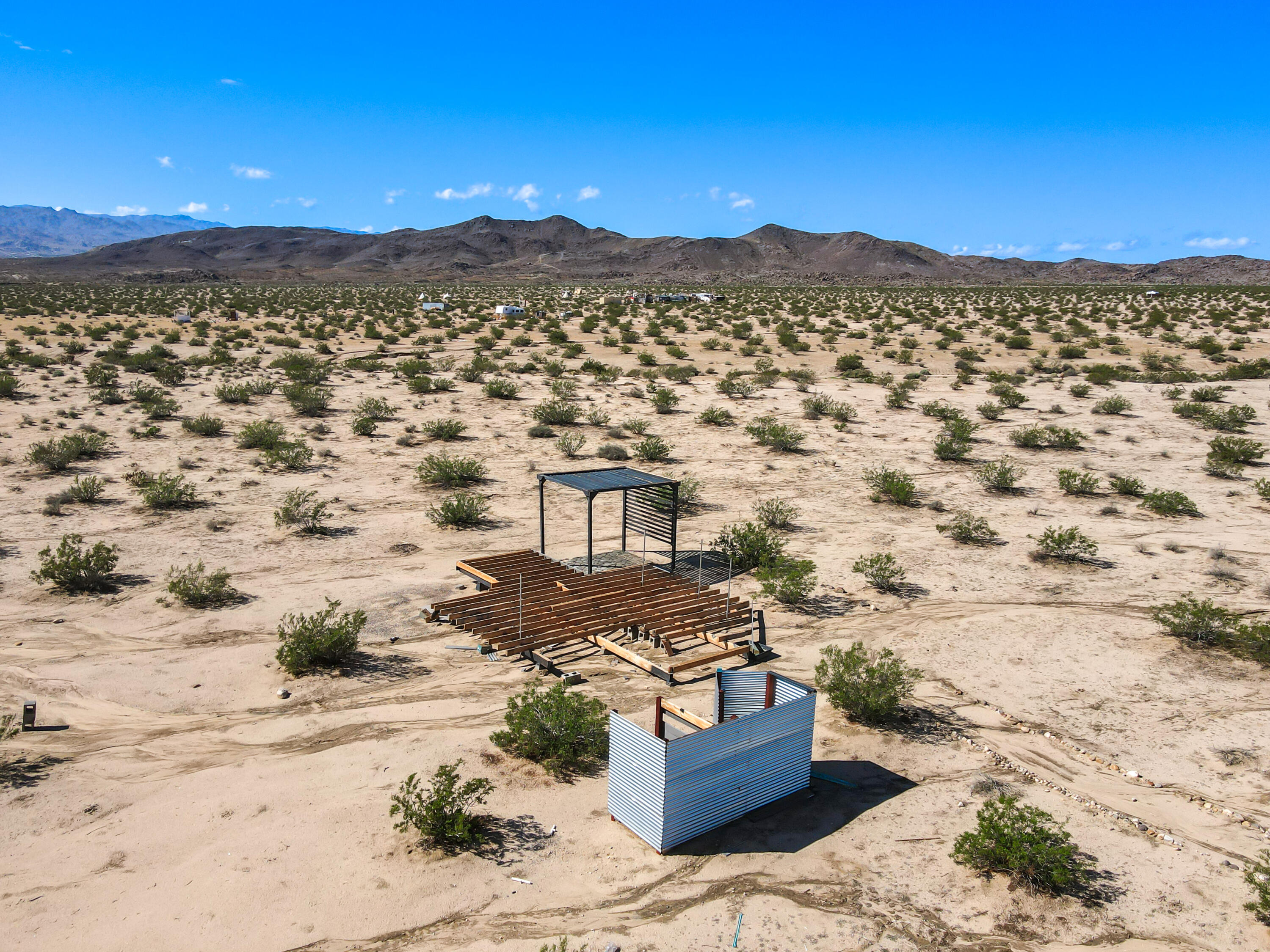 2100 Copper Moon Lane Joshua Tree, CA 92252 - Photo 2 of 28 a view of a city with mountain