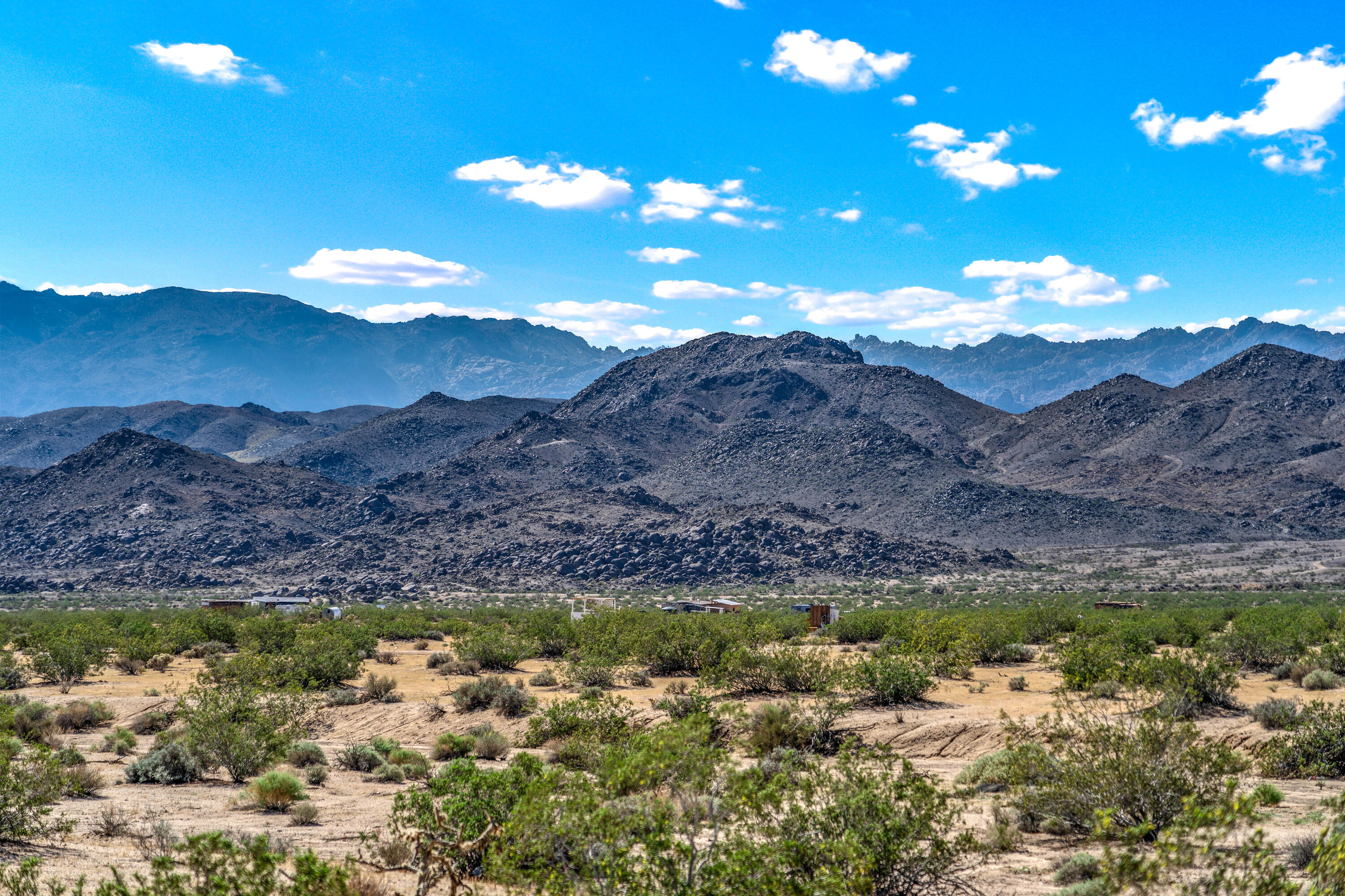 2100 Copper Moon Lane Joshua Tree, CA 92252 - Photo 4 of 28 a view of a lake with mountains in the background