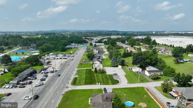 an aerial view of a house with a garden