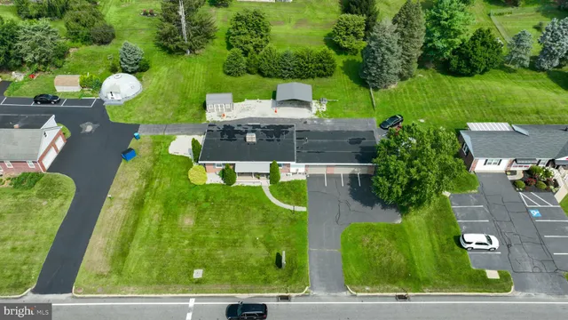 a view of an house with backyard space and garden
