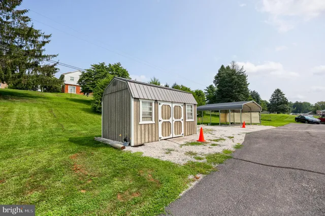 a view of outdoor space with playground and green space