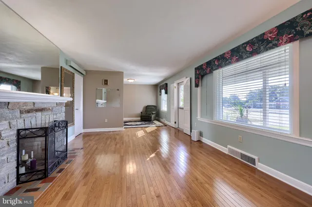 a view of a kitchen with a sink and a window