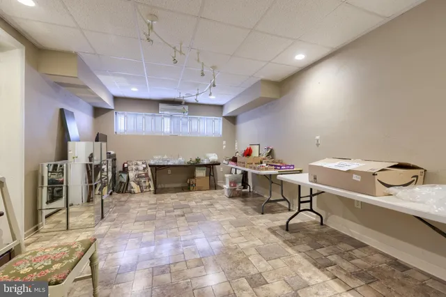 a kitchen with a sink window and cabinets