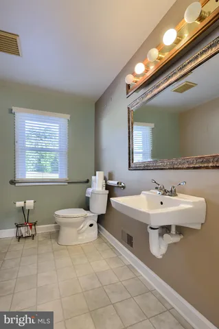 a room with pool table and a window