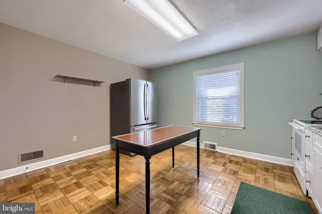 a bedroom with a bed and a fireplace