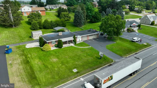 an aerial view of a pool with a patio