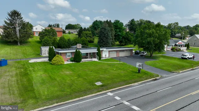 a view of a water fountain in front of the house