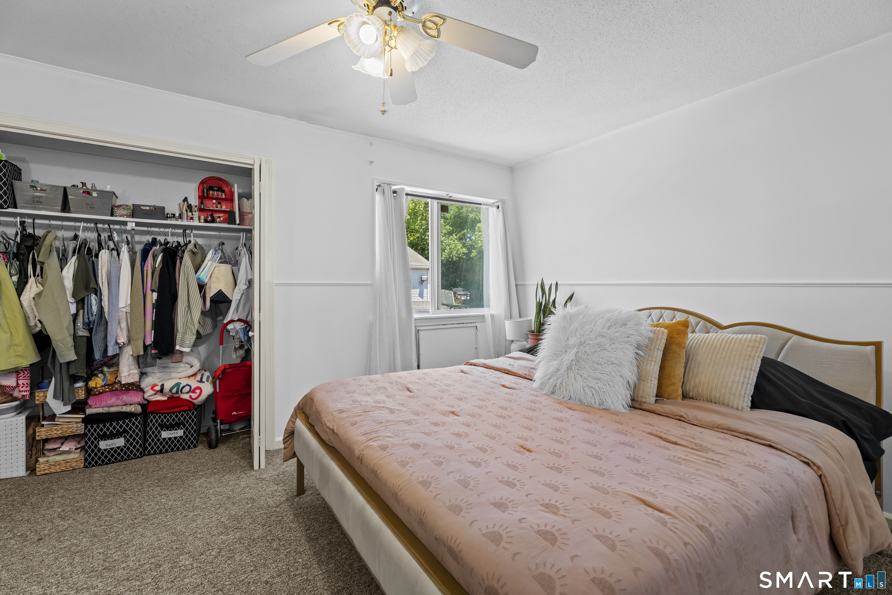 23 Pearl Lake Road, Unit B Waterbury, CT 06706 - Photo 9 of 14 a bedroom with a bed and a walk in closet
