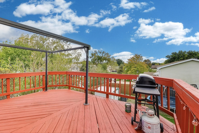 257 Bryant Way Bolingbrook, IL 60440 - Photo 16 of 20 a view of balcony with wooden floor and fence