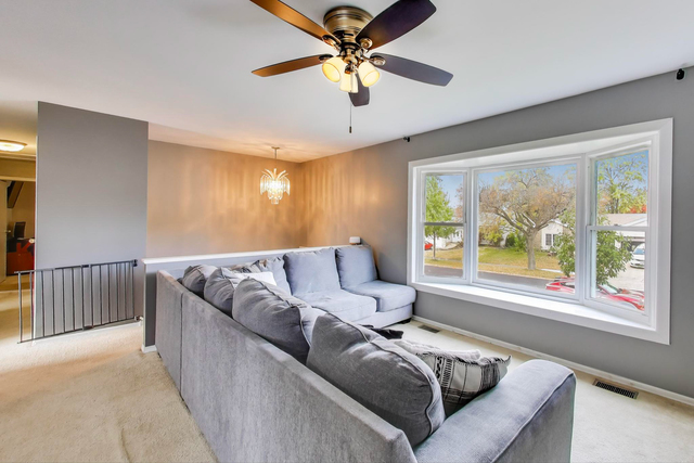 257 Bryant Way Bolingbrook, IL 60440 - Photo 3 of 20 a living room with furniture and a large window