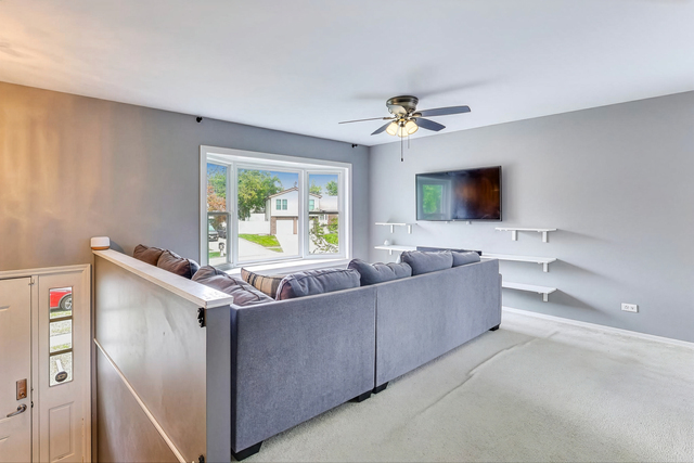257 Bryant Way Bolingbrook, IL 60440 - Photo 5 of 20 a living room with furniture and a flat screen tv