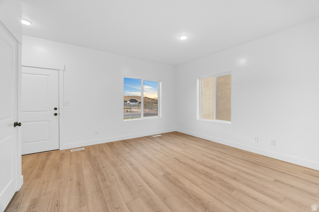 1563 South Deerbrook Road, Unit 267CHM Santaquin, UT 84655 - Photo 5 of 13 Bright room featuring wood-finish flooring, recessed lighting, and white walls