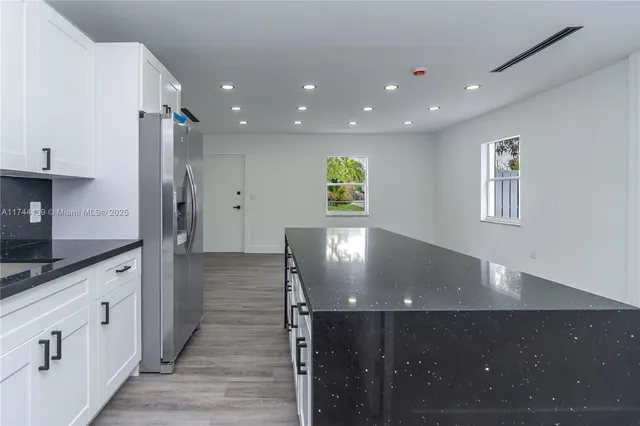 a view of a kitchen with cabinets