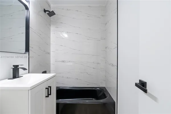 a view of a house with a backyard and a garage