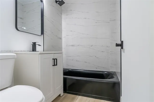 a bathroom with a toilet and a sink