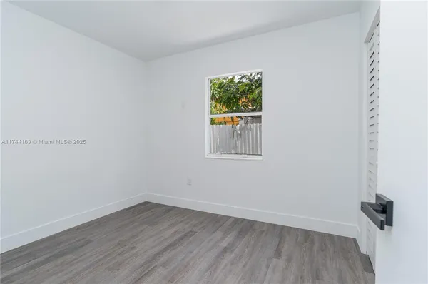 a house view with a backyard space