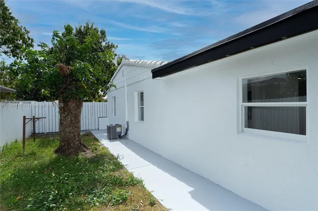a house view with a backyard space