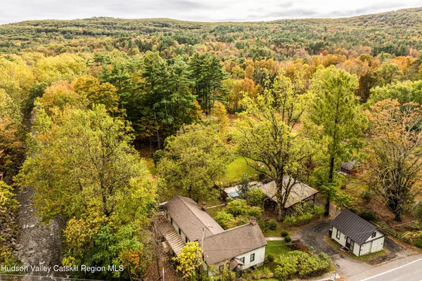 an aerial view of residential houses with outdoor space