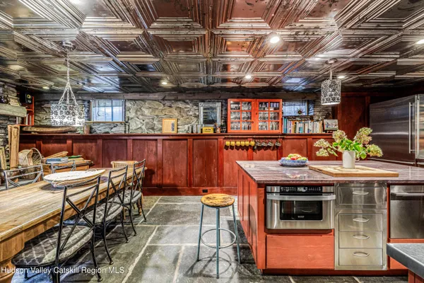 a kitchen with stainless steel appliances granite countertop a stove and cabinets