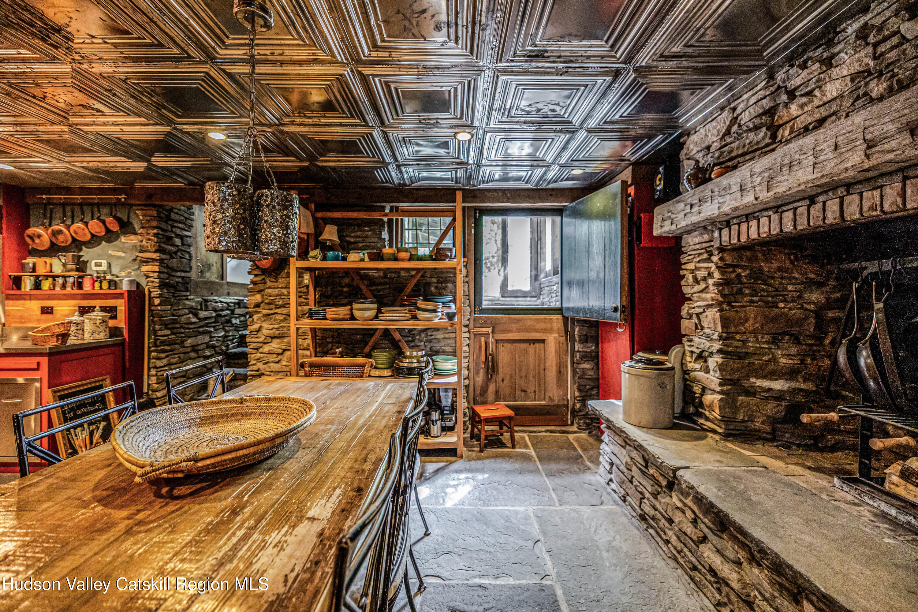 1 Wittenberg Road Bearsville, NY 12409 - Photo 23 of 72 a room with lots of wooden furniture and a chandelier