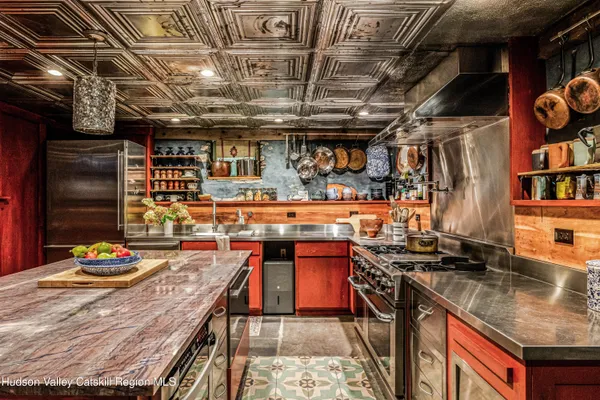 a living room with furniture a rug and a window