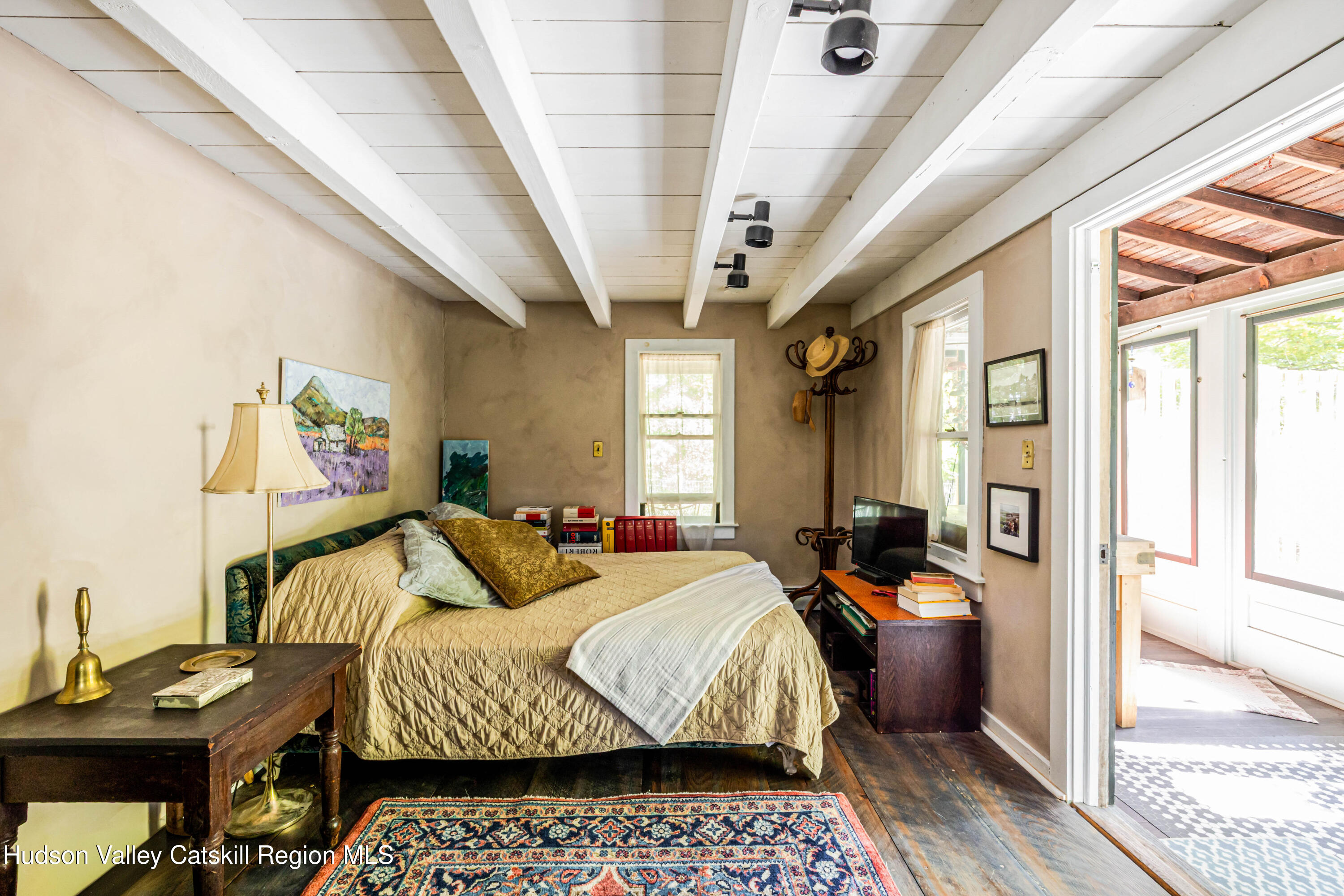 1 Wittenberg Road Bearsville, NY 12409 - Photo 25 of 72 a bedroom with a bed and wooden floor