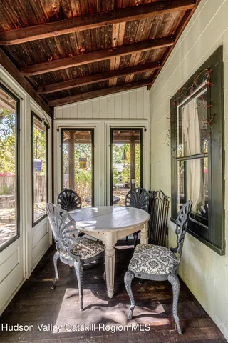 a living room with furniture a rug and a lamp