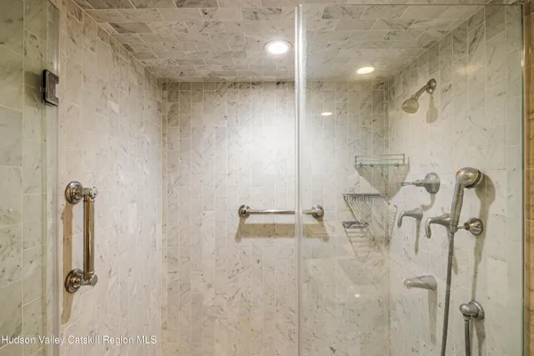 a dining room filled with furniture and a potted plant